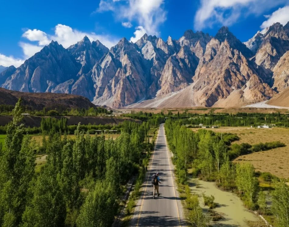 Solo traveler enjoying mountain views in Hunza Valley, Pakistan